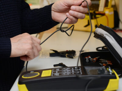 Technician calibrating a PAT tester
