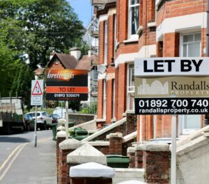 row of properties with rental signs